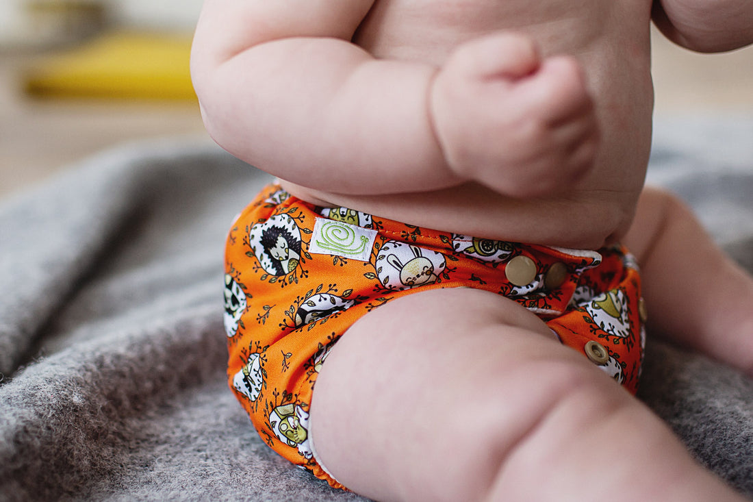 baby wearing a baba and boo pocket reusable nappy 
