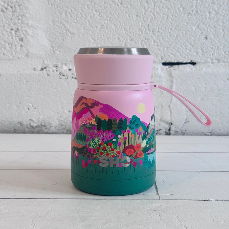 SHO reusable flask in mountain scene pink sky and green mountains 