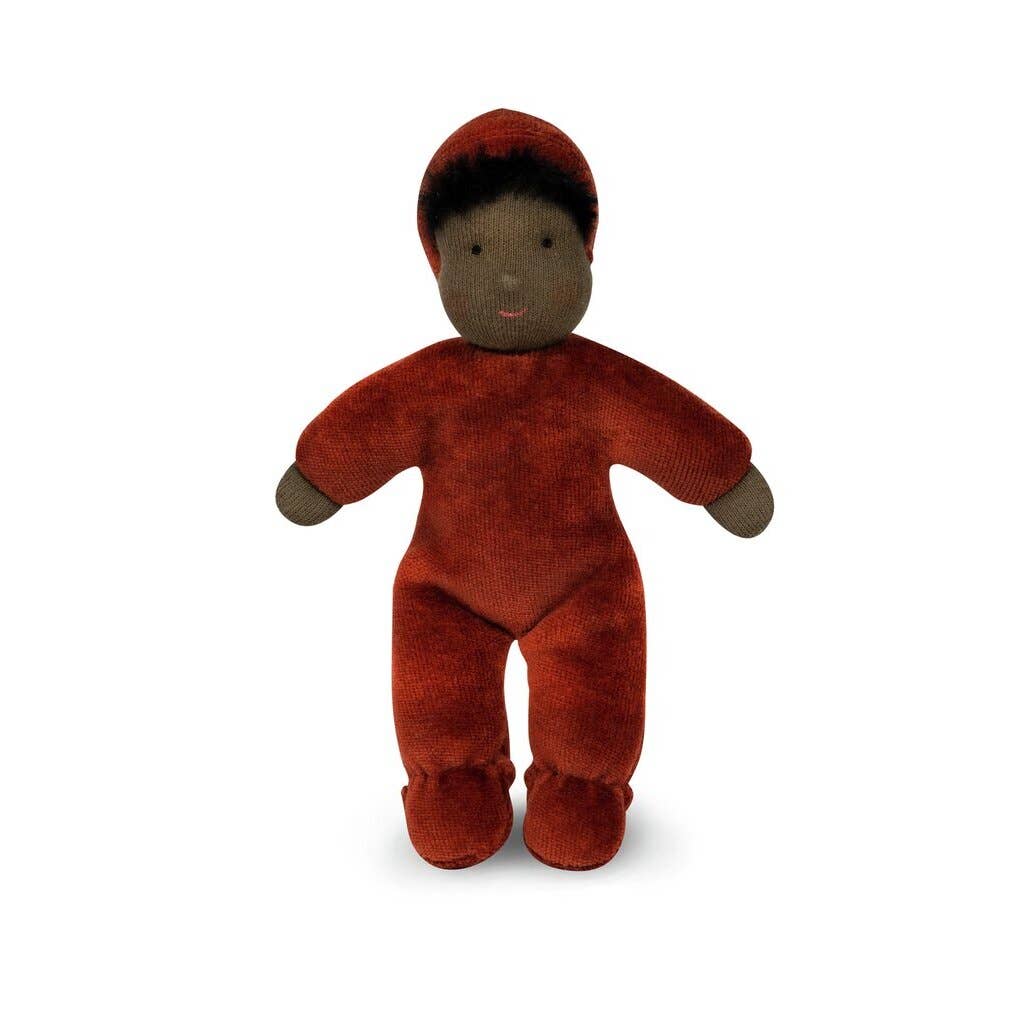 Small brown plush toy with a red hat on a white background