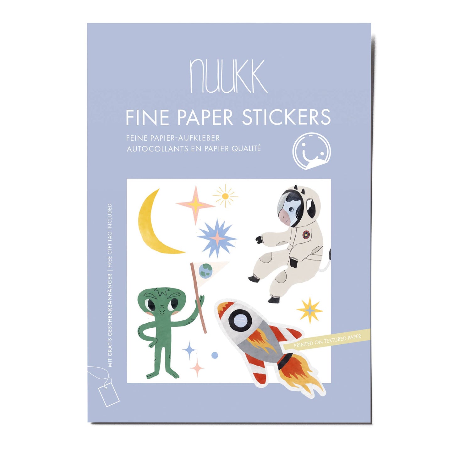Nuukk fine paper stickers packaging with space-themed illustrations on a light blue background