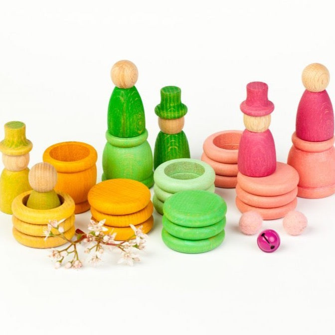 spring nins grapat - pastel coloured peg dolls on a white background